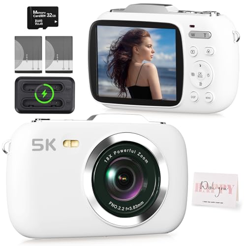 Camcordy 5K Vlogging Camera in white on a tidy desk next to a mini tripod, 32GB card, and travel notebook